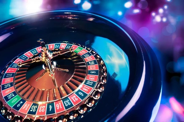 Multi-camera live-dealer studio showing roulette wheel and dealer in real-time broadcast